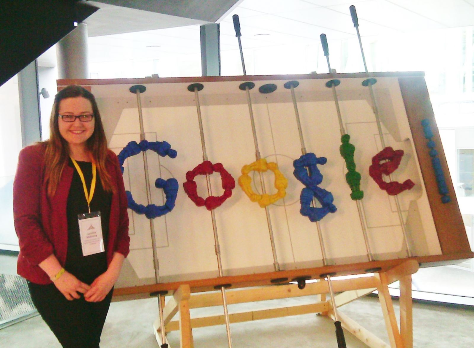 Caroline at the Google offices with a foosball table in Google