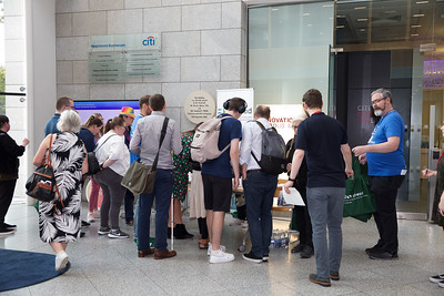 A photo of a crowd of people queuing for registration. Volunteers and AHEAD staff also in photo. 