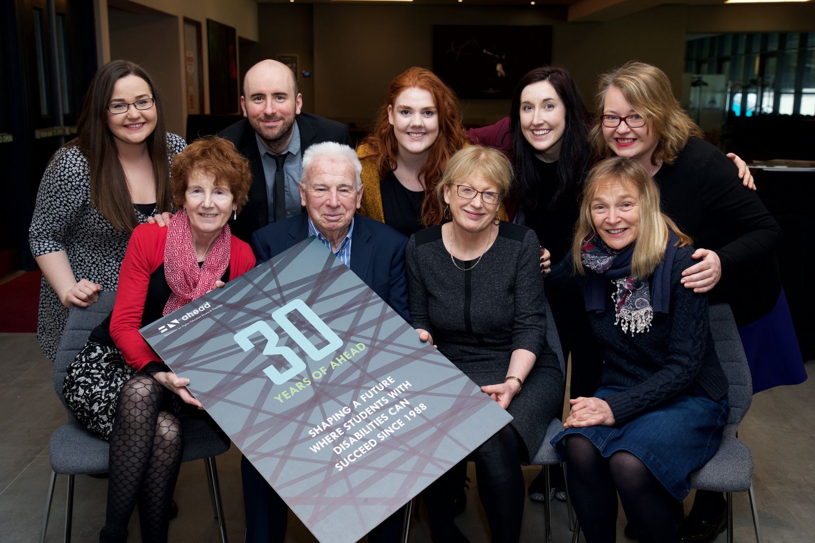 Prof. John Kelly celebrates AHEAD's 30th birthday with AHEAD Director Ann Heelan and the rest of the AHEAD team