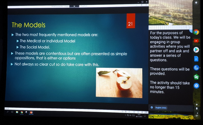 Image showing Chromecast on a projection screen with split view between PowerPoint & Live Transcribe