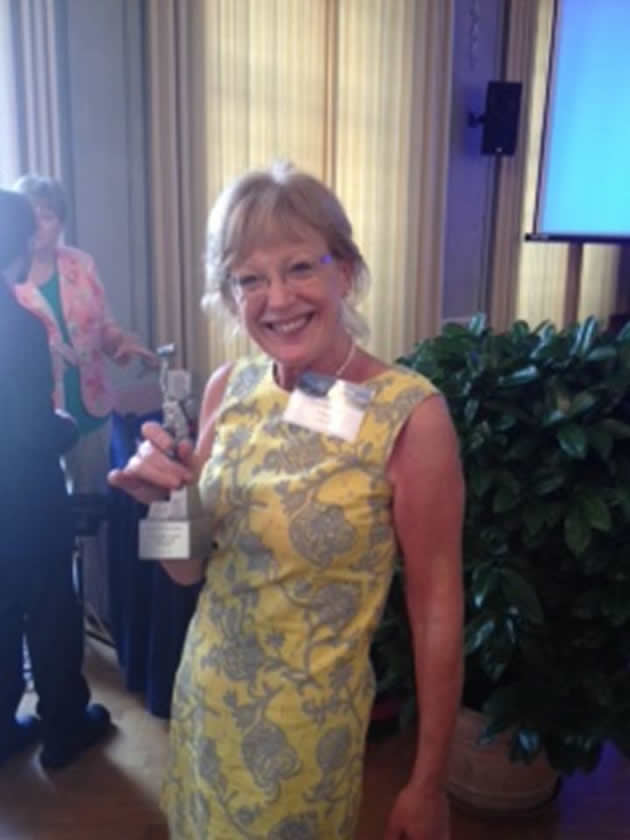 Ann Heelan picture holding the Myriam Van Acker Award
